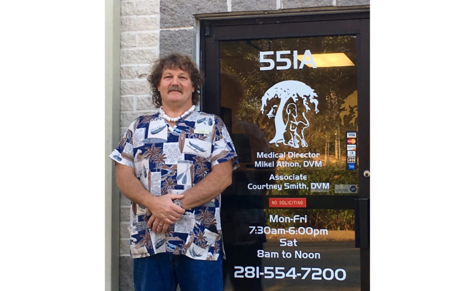 Dr.Mikel Standing Next to the Front Door of the Hospital